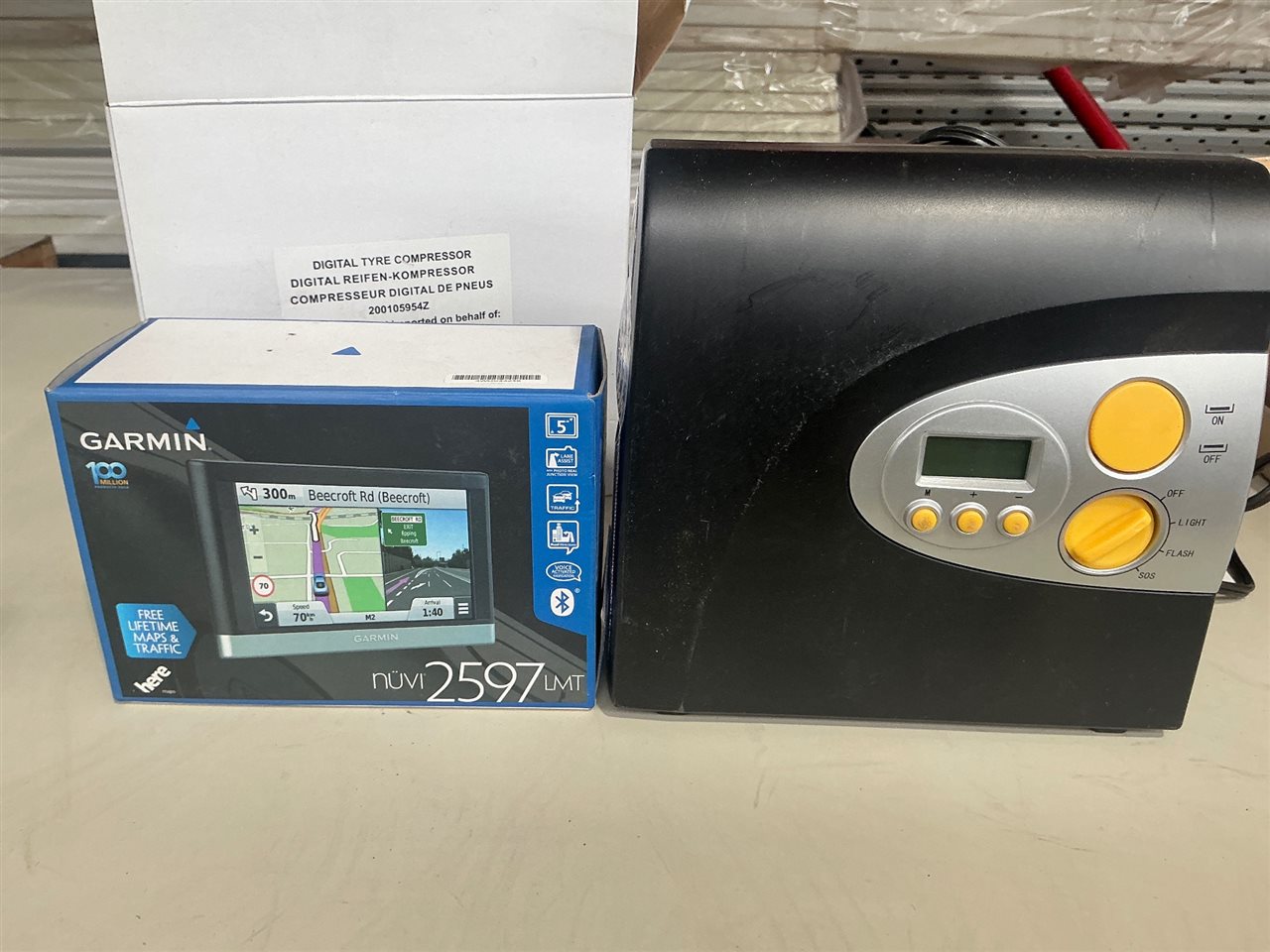 Digital Tire Compressor 12 V and A Garmin Navigation Unit
