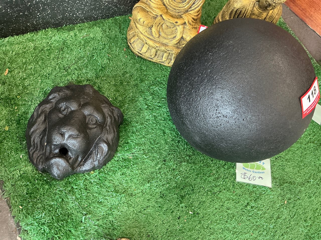 Solid Black Sphere Garden Ornament and Lion Head Wall Spout